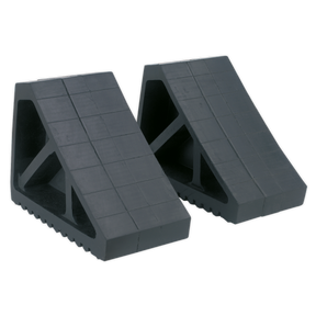 Two Sealey Rubber Wheel Chocks - Pair - WC02, featuring a black rubber construction with a grid pattern on the surface, designed to prevent vehicle movement when jacked on a level surface.