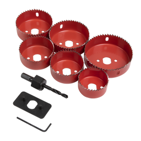 The Downlight Hole Saw Kit 9pc - WDLK by Sealey includes six red hole saws of varying sizes, an arbor with a pilot drive, a black hex key, and a black tool plate, all arranged on a white background—ideal for cutting out spaces for downlights.