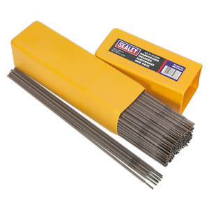 A yellow box of Sealey Welding Electrodes Hardfacing Ø2.5 x 300mm 5kg Pack - WEHF5025 is open, revealing several electrodes neatly packed inside and some laid out beside the box—ideal for repairs on agricultural and construction machinery.