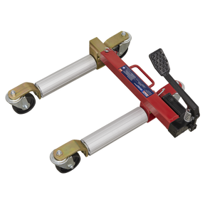The Sealey Wheel Skate Hydraulic 680kg Capacity - WS680, featuring a red and silver design with a black rubber pedal, four wheels, and aluminum rollers, is ideal for moving an immobile vehicle.