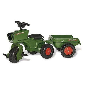 The Fendt 314 Vario Tricycle with trailer (X991022242000) by AGCO is displayed, featuring a green body, black seat, red wheels, and an attached trailer. It also includes a sound steering wheel for added enjoyment.