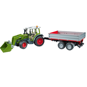 A Fendt 211 Vario toy model with a front loader attachment, reminiscent of AGCO's detailed craftsmanship, is pulling a red and silver sideboard trailer equipped with two sets of wheels.