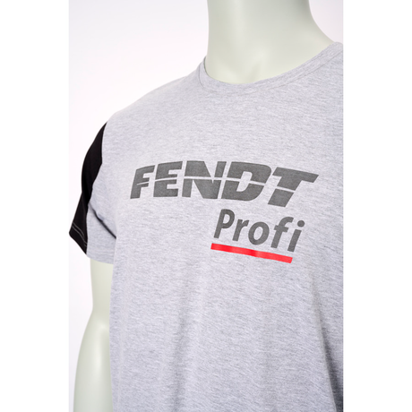 Close-up of a grey Fendt - Profi T-Shirt, blended fabric (X991023059000) displaying the reflective logo in black and red text. The mannequin wearing the sporty AGCO branded T-shirt is partially visible, emphasizing its high wear comfort.