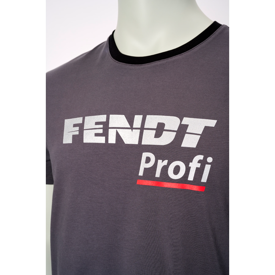 Close-up of a person wearing an AGCO Fendt - Profi T-shirt in grey and black, featuring the text "FENDT Profi" in white and red letters, designed for high wear comfort.