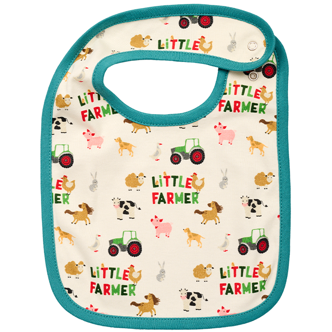 This Fendt baby bib by AGCO, model X991023156000, features teal trim and an all-over print of farm-themed images such as tractors and animals, along with the text "LITTLE FARMER" repeated throughout. It's crafted from soft Bio-cotton to ensure your little one's comfort.