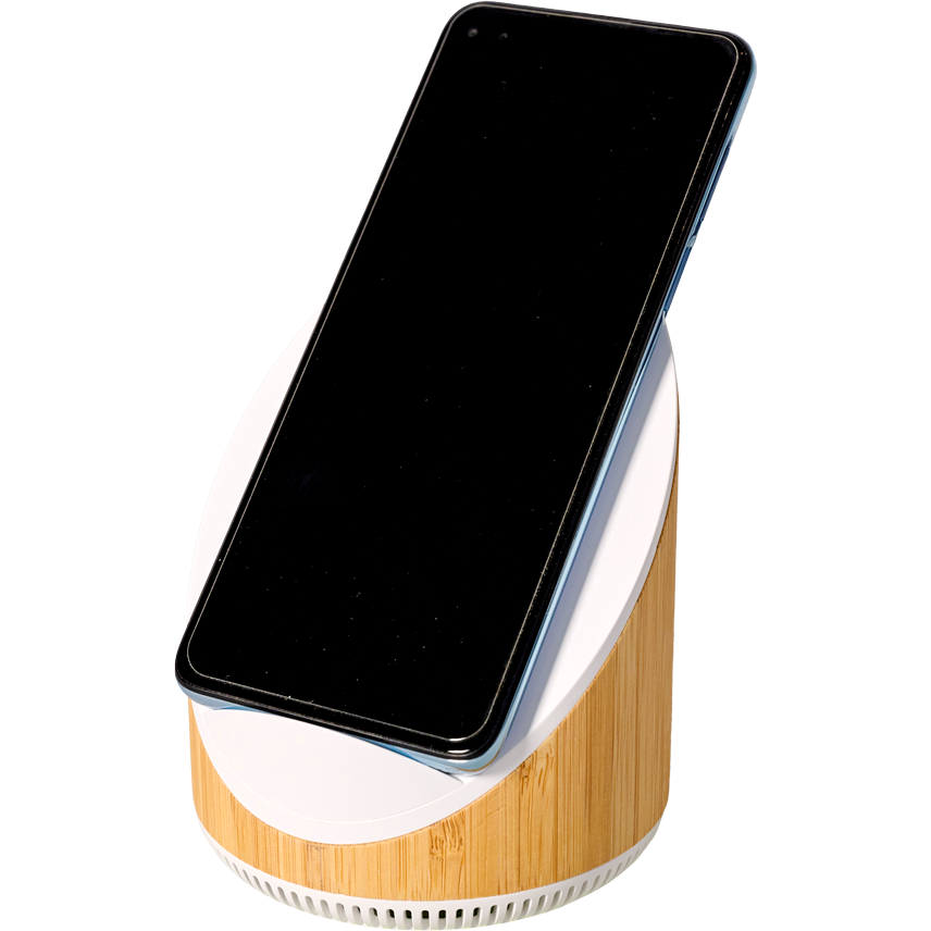 A smartphone rests on an AGCO Massey Ferguson Speaker and Phone Charger (X993342305000) tilt stand with a wood finish and built-in 15W fast wireless charger, displaying a blank black screen.