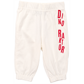 White elastic-waist pants from AGCO's Massey Ferguson Baby Dino Raktor collection, featuring red vertical "DRINKATOR" lettering on the right leg (Product Code: X993602303100).