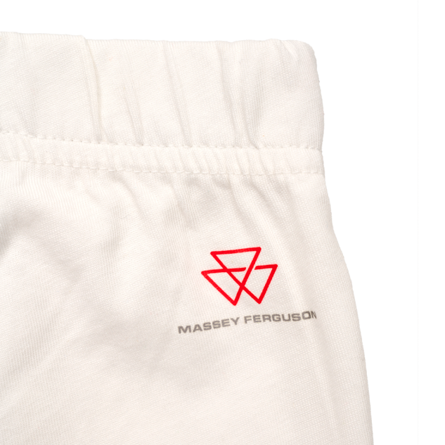 Close-up of white fabric with an elastic waistband, featuring a red Massey Ferguson logo and text, part of the delightful AGCO Massey Ferguson Baby Dino Raktor Pants collection (X993602303100).