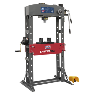 A hydraulic shop press labeled "Sealey YK509FAH" comes with a digital display and boasts a sturdy, heavy-duty steel frame in grey and red. It features a foot pedal for operation, a side handle, and a ram pressure gauge for precise control.