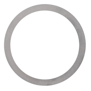 An AGCO Adjusting Shim - 3389385M1, a thin, circular metal ring with a smooth surface, commonly found in Massey Ferguson systems.