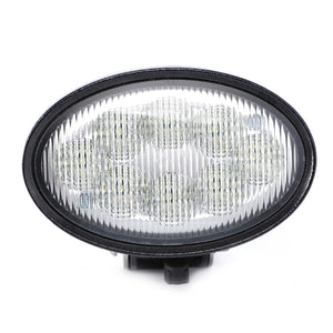 Close-up of the AGCO | Work Light, LED - Acw1547170, an oval-shaped and durable work light featuring a black frame and a ribbed, transparent cover designed for low energy consumption.