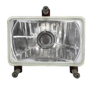 An AGCO Genuine Headlight, model ACP0377740, features a rectangular, front-facing design with a clear lens and is securely mounted on a metal bracket with four visible bolts. Designed specifically for tractor headlights, it ensures durability and reliability.