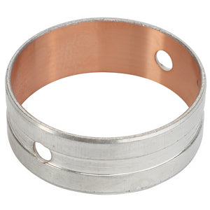 The AGCO BEARING BUSHING - F836200210380 is a cylindrical metal bushing with a copper interior and two precisely aligned holes on opposite sides.