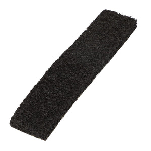 A rough-textured rectangular black scouring pad; AGCO | Gasket - Acp0668430 by AGCO.