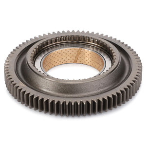 The AGCO Pinion - 4305226M92 is a metallic gear featuring an outer ring of teeth and an inner cylindrical bearing, which appears to have a perforated, potentially bronze surface. This high-quality component is compatible with Massey Ferguson models and sourced from AGCO Parts Genuine for assured quality.