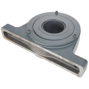 The AGCO Cylindrical Roller Bearing - Acw1211020 is a metal bearing housing assembly with a cylindrical opening and a rectangular base featuring a horizontal slot, specifically designed for high-speed operation and capable of accommodating high loads.