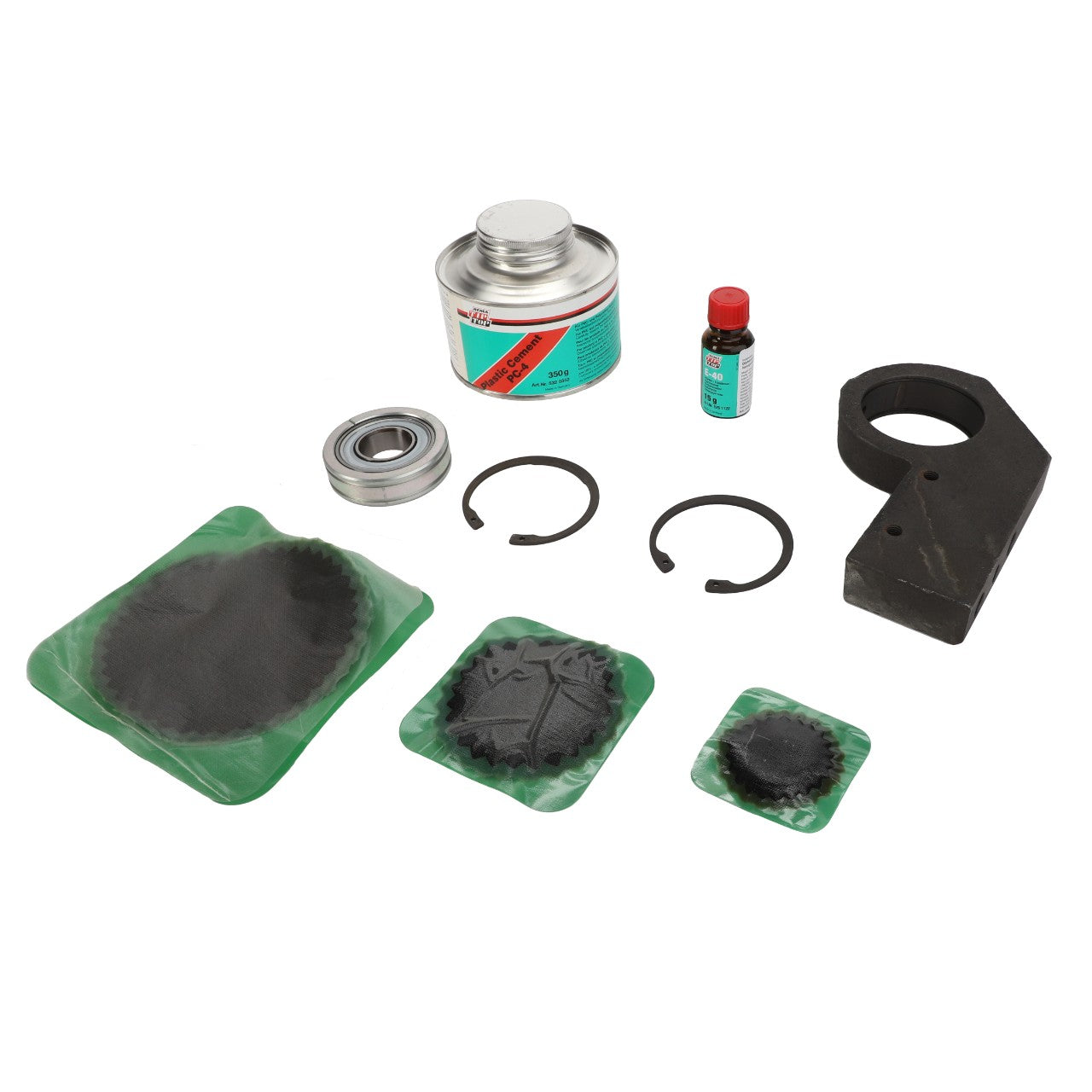 Product Description: The AGCO BEARING CARRIER - D28251562, featuring various machinery parts and maintenance items including a can of cleaner, a small bottle of liquid, two circular rings, two sealed components, a housing part, and a bearing, is displayed on a white background.