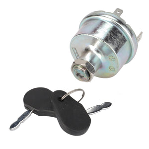 An AGCO Ignition Switch - Acp0285950, featuring a sleek metallic design, comes with a set of two keys on a sturdy keyring placed neatly beside it.