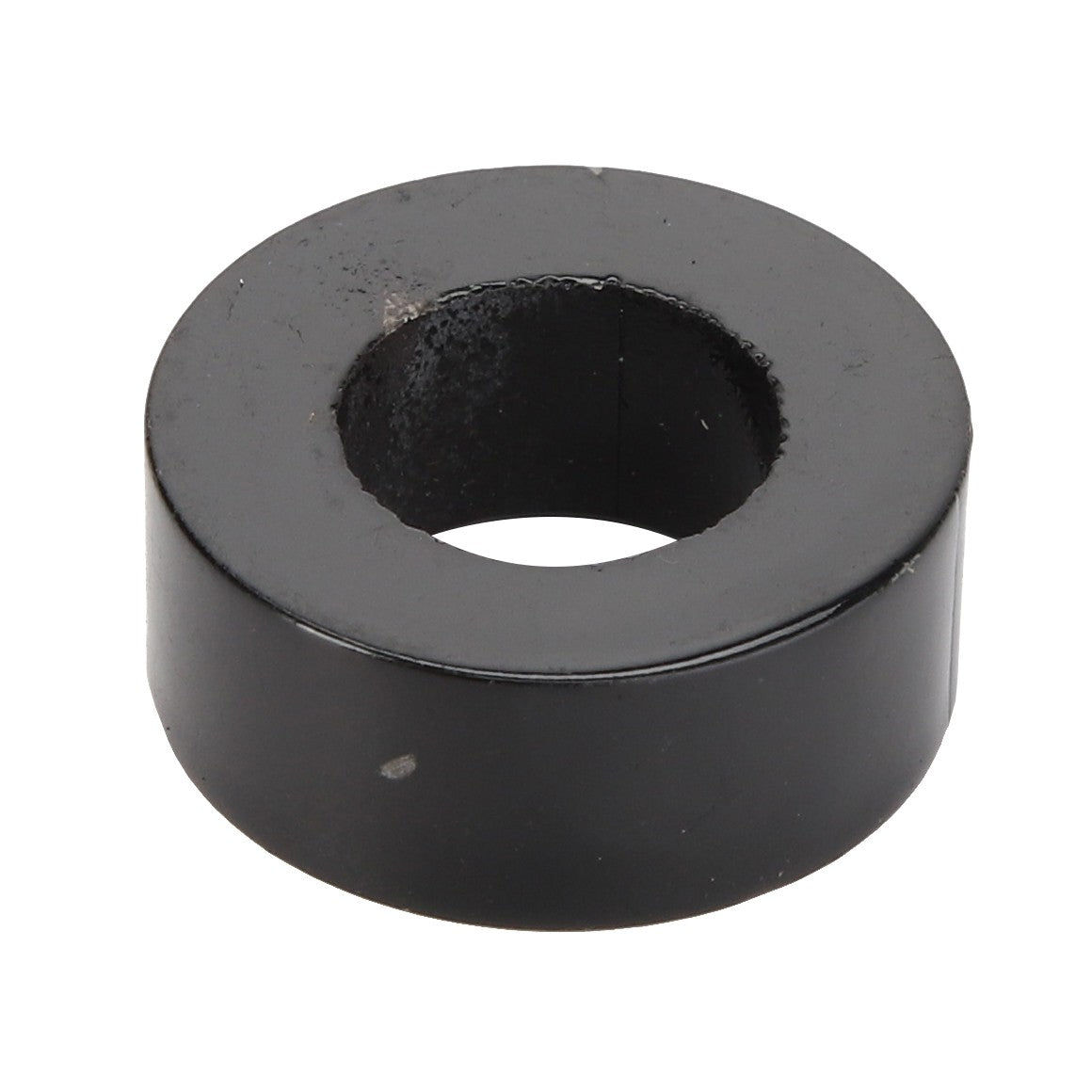 The AGCO | BUSH - AG120283 by AGCO is a black, cylindrical metal washer with a central hole used typically as a spacer or to provide a bearing surface in mechanical applications.