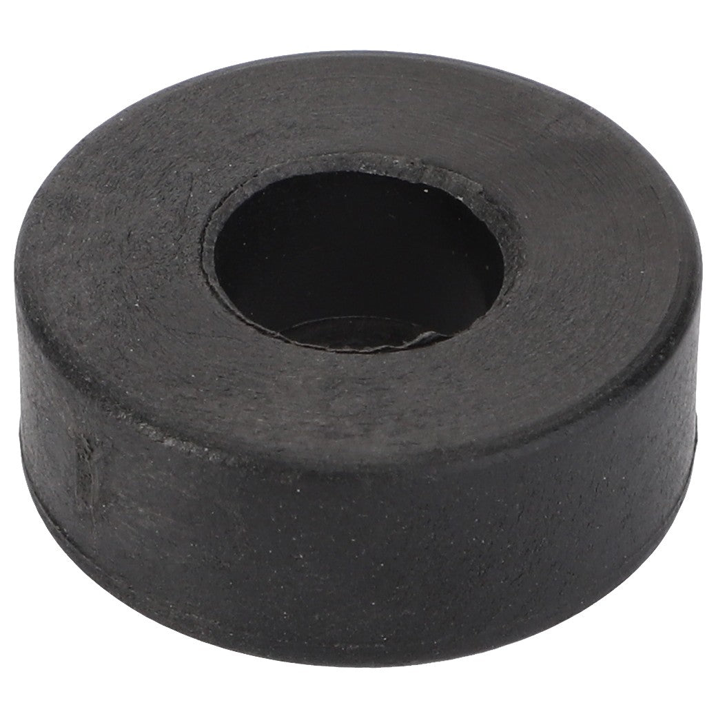 The AGCO Roller - La320927050 by AGCO is a black, round rubber grommet with a central hole, designed for durability and versatility.