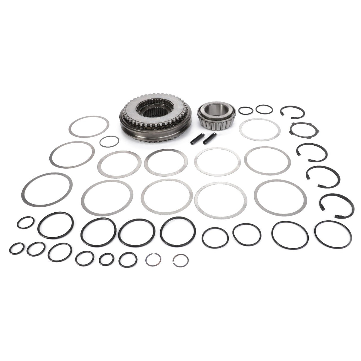 A set of various sized metal gears and multiple circular rubber and metal seals, ideal for Massey Ferguson models and neatly arranged on a white surface. Product: AGCO Kit Service - 4307068M12 by AGCO.