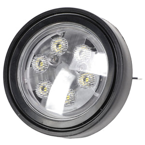 The AGCO | LAMP - ACP0401710 features a round LED light with a black casing and six visible LED bulbs inside. It boasts a clear lens and has a small section of attached wiring on the side. For any ordering inquiries or assistance, please contact our support team.