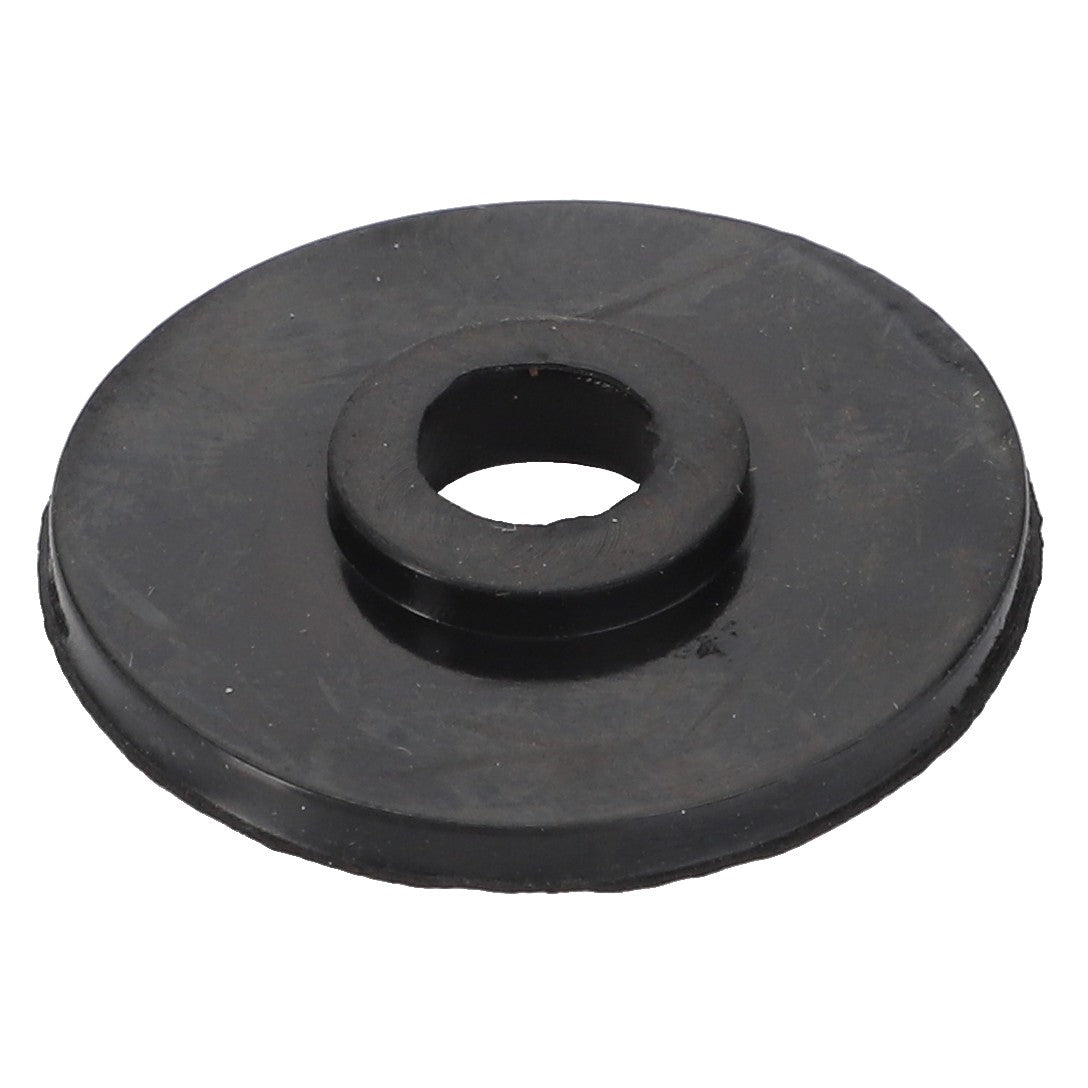 The AGCO Washer - Acw1093670, a black rubber flat washer featuring a central hole, is commonly employed to provide cushioning and sealing in mechanical assemblies, guaranteeing durability and reliability.