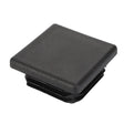 The AGCO Plug - Acw9221570 is a black rectangular plastic end cap with a textured surface and ridged edges, meticulously designed to fit into hollow tubing or open-ended structures.