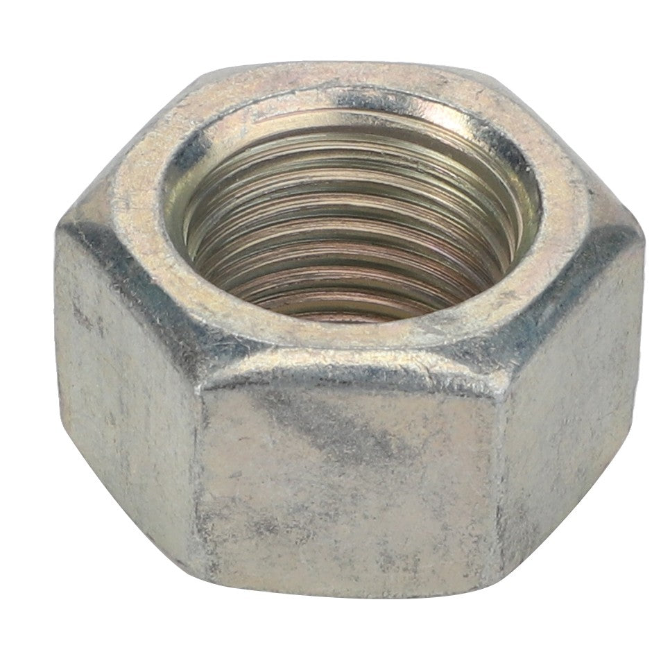 Close-up of an AGCO | Nut - Acp0300920, a metallic hexagonal nut with internal threading, commonly used for fastening applications in conjunction with a bolt.