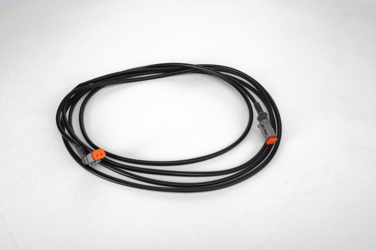 The AGCO | HARNESS - ACP0426710 is a coiled black cable featuring two orange connectors on a white background, making it an ideal addition to your current product lineup. For any queries or assistance, please reach out to our support team.