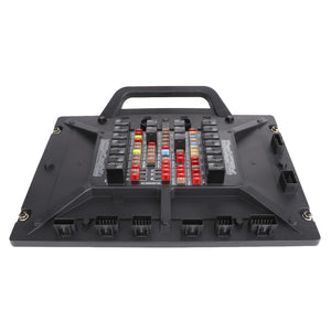 AGCO Module - Acx003572C: A black vehicle fuse box with a handle from AGCO, featuring various colored fuses and connectors arranged in organized rows and columns.