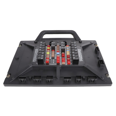 AGCO Module - Acx003572C: A black vehicle fuse box with a handle from AGCO, featuring various colored fuses and connectors arranged in organized rows and columns.