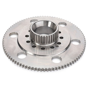 A metallic annular gear with a central hub, featuring multiple holes and teeth around its edge, likely used in industrial or mechanical applications, AGCO's Ring Gear Carrier - F737300020060 exemplifies durability and precision engineering.