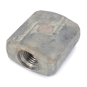 A slightly weathered AGCO | Special Nut - 135872040040, featuring a threaded hole and rectangular design, reminiscent of the dependable components found in Fendt Models of the FARMER Series.