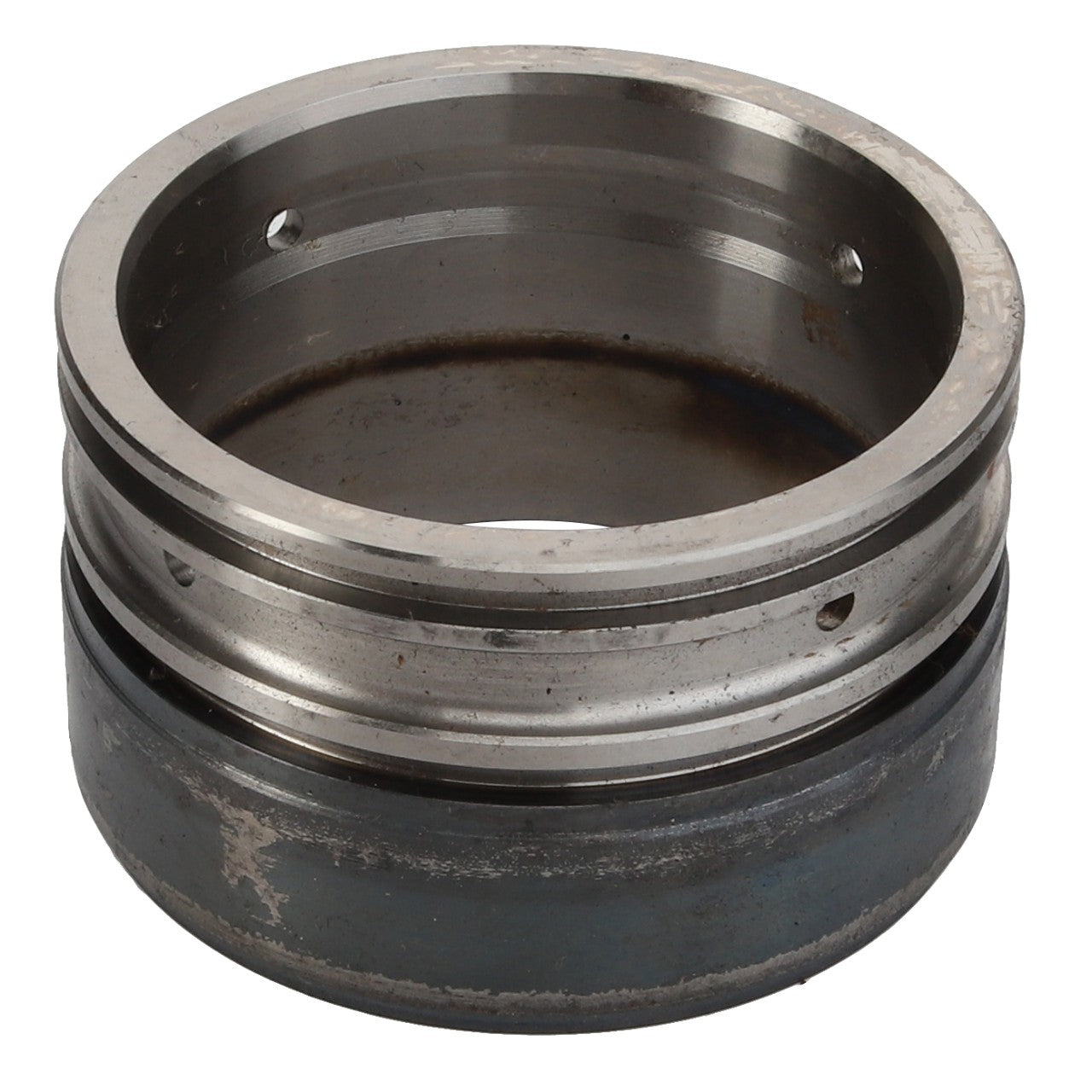 A slightly worn AGCO Bush (411151150070) metal cylindrical component with a hollow center and grooves, resembling those found in Valtra or Massey Ferguson machinery.