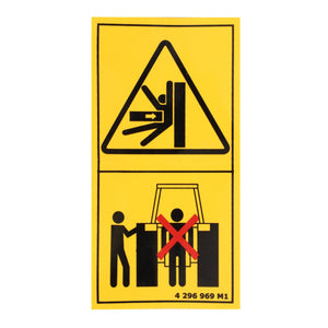 A yellow caution sign illustrates the potential danger of getting limbs caught in machinery, with a warning not to stand between operating barriers. Perfect for Massey Ferguson models, the AGCO Decal, Safety - 4296969M1 is an essential part of agricultural engineering for ensuring safety.