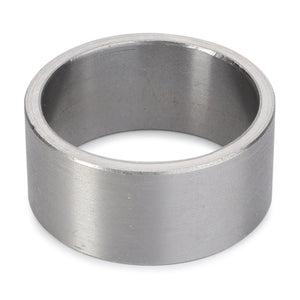 A close-up of the AGCO Bush - La300129094, a cylindrical metal ring with a smooth surface, showcasing its empty interior and uniform thickness.