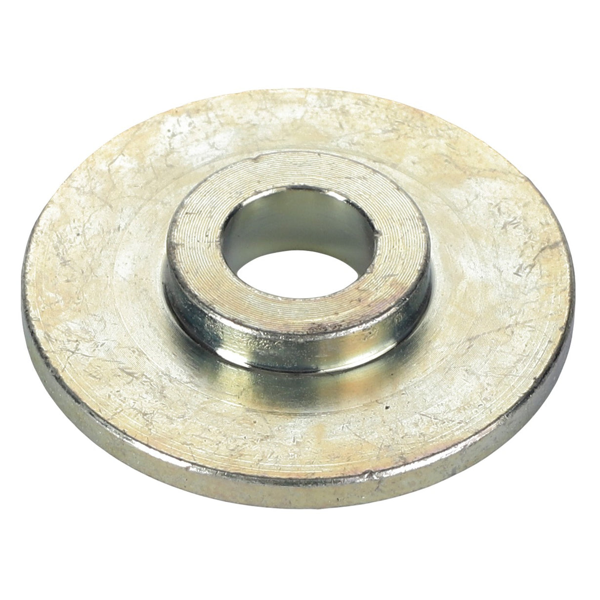 The AGCO Pivot Bushing - Acw3761810 is a circular metallic washer with a central hole and a slightly raised inner ring, showcasing impeccable craftsmanship.