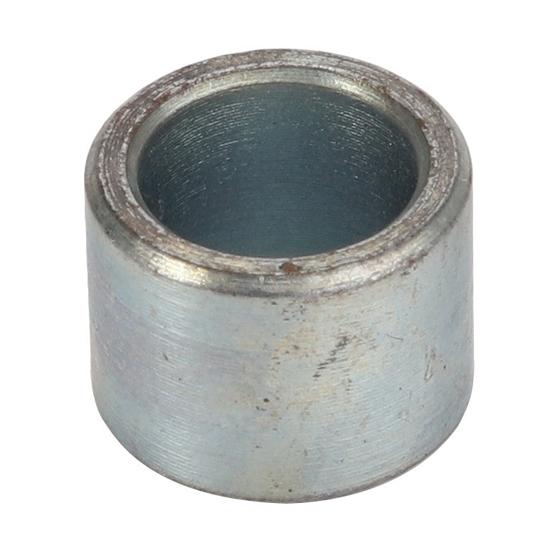 The AGCO Spacer - Acw1043760 is a cylindrical metal component with a hollow center, and it features a slightly weathered surface. Unfortunately, there is no additional product description information available at this time.