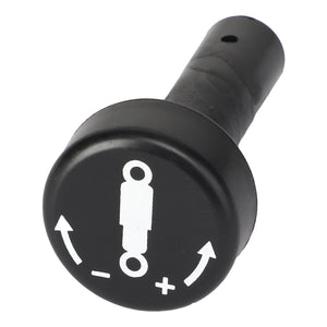 The AGCO | Knob - Acw1028600 from AGCO is a sleek black knob featuring a white graphic with two directional arrows, symbols for plus and minus, and a central figure.