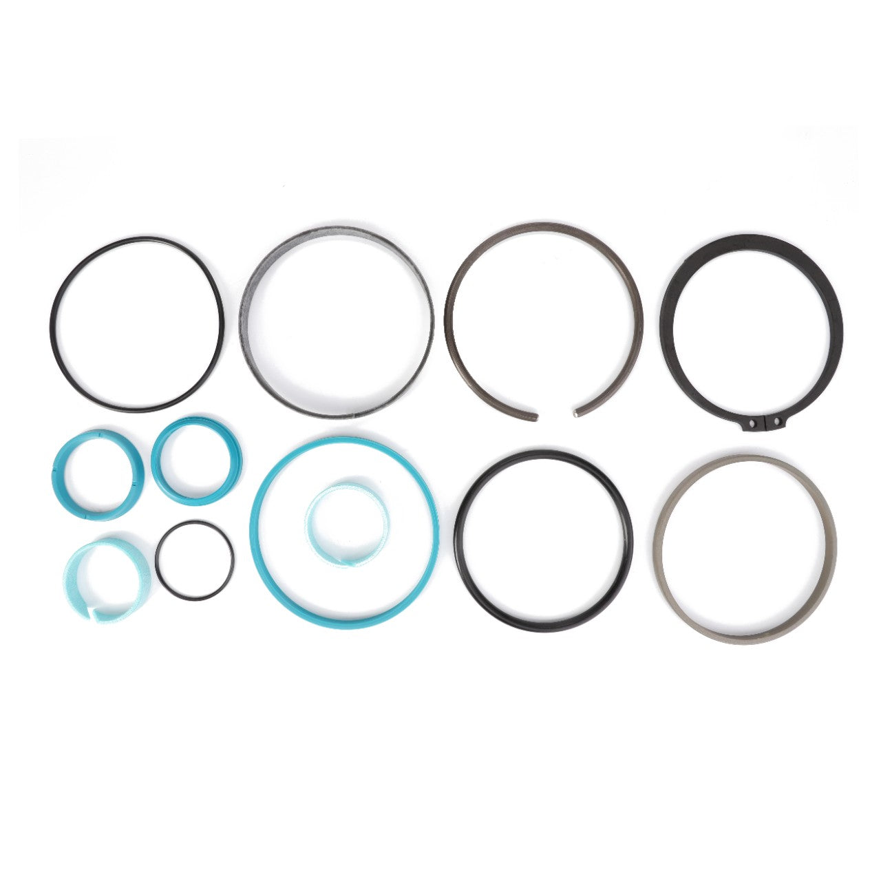 A selection of high-quality AGCO Parts hydraulic cylinder seals, including black, blue, and translucent rings in various sizes from the AGCO Seal Kit F931860030100, arranged on a white background.