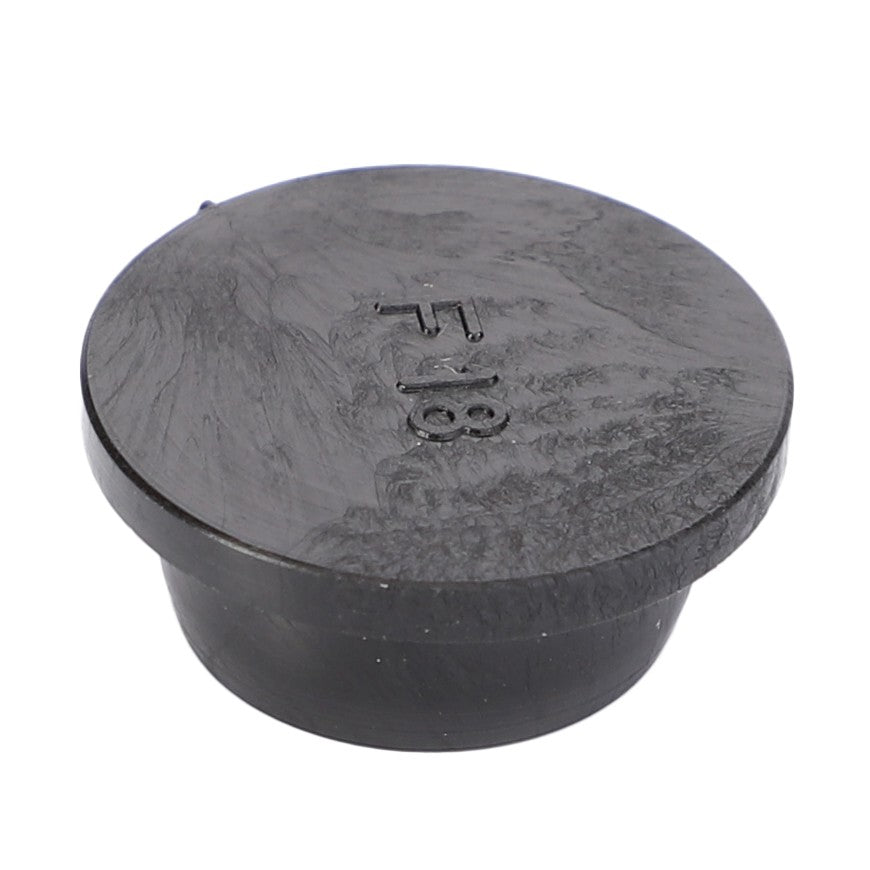 The AGCO Locking Plug, Dashboard - X499503696000 by AGCO, is a black plastic, round-shaped cap with a raised lip and the marking "718" on the top surface that adds a touch of utility to your Fendt Vario.