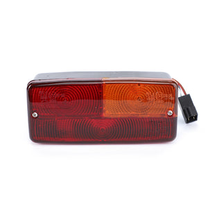 Enhance your vehicle's lighting with the AGCO Genuine Combination Light for the rear right side, featuring red and amber sections and a black electrical connector on the side. Designed for optimal illumination and durable quality, it includes 12V 21W and 12V 10W bulbs under part number 3781445M92.