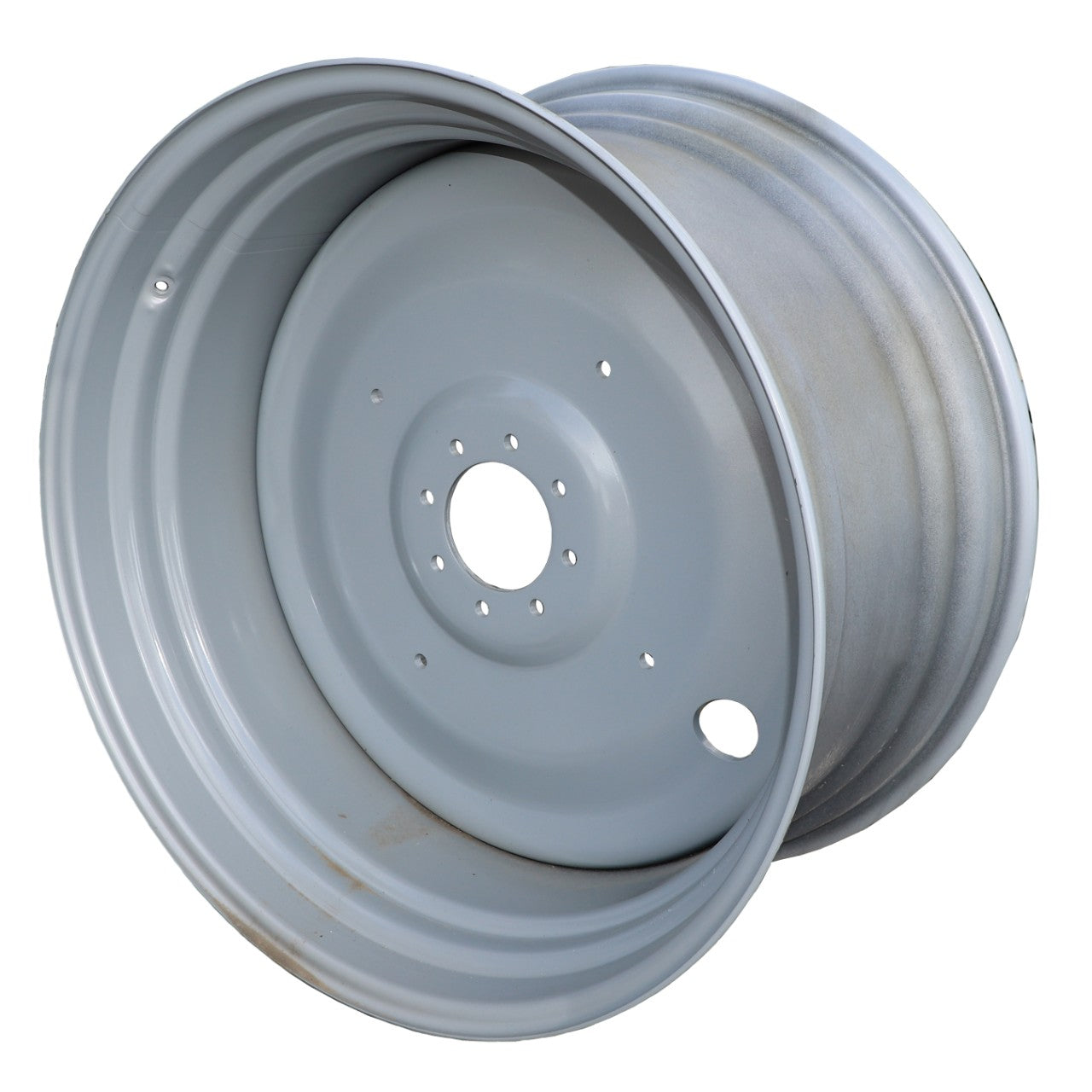 The AGCO Wheel Rim - 4355977M92 features a silver metal finish, multiple holes around the center, and a slightly worn surface, making it suitable for Massey Ferguson Models.