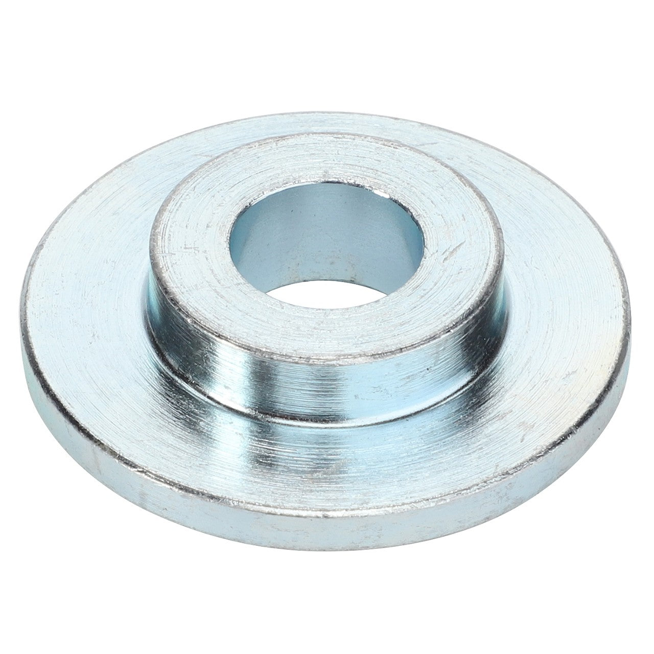 The AGCO | Spring Seat - 3203-01-04-11 is a silver metal spacer with a central hole, featuring a wider base and a narrower top section, compatible with Massey Ferguson Models.