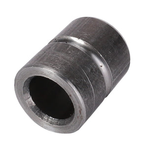 An AGCO Bushing - 700122681, a cylindrical metal component featuring an inner and outer diameter along with a smooth, slightly scratched surface, is commonly used as plain bearings in Fendt Models.