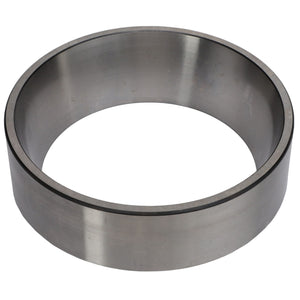 A metal cylindrical ring viewed from an angle, showcasing its smooth and polished surface, reminiscent of the robust AGCO | BEARING CUP - AG721070 used to handle thrust loads in the off-road industry.