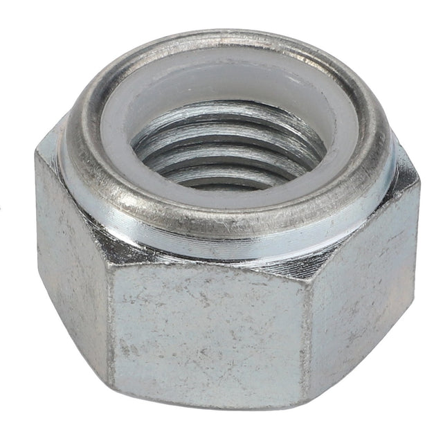 A close-up of the AGCO | Nut - Acp0497950, a metal hex nut with internal threading and a nylon insert, commonly known as a nyloc nut.