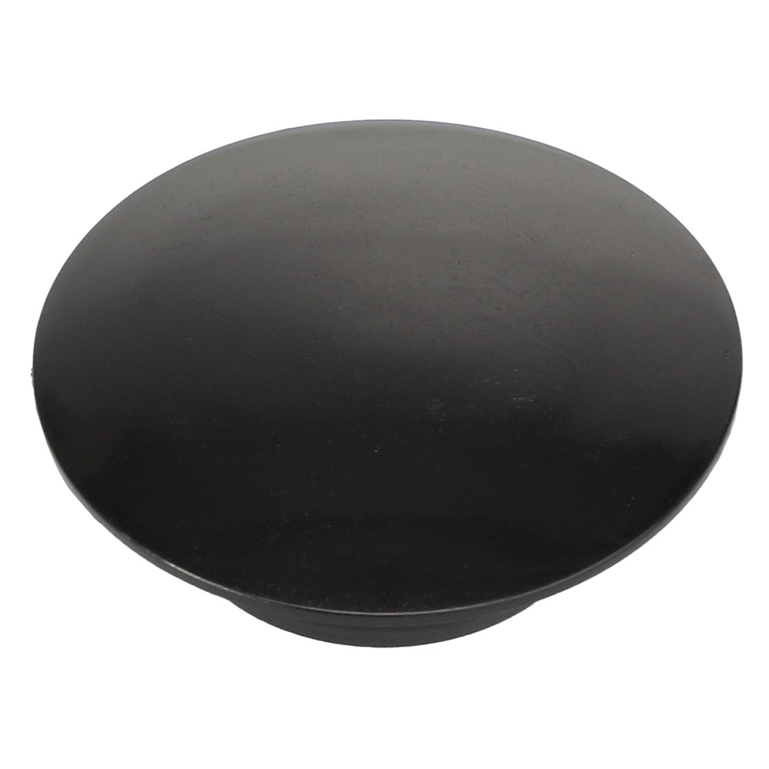 The AGCO PLUG - AL5022119, a black circular rubber stopper, sits against a pristine white background, creating a striking contrast.