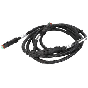 The AGCO Jumper - Acw214970A is a coiled black automotive wiring harness, featuring two connectors at both ends and attached labels on various sections. Further product description information is not available.